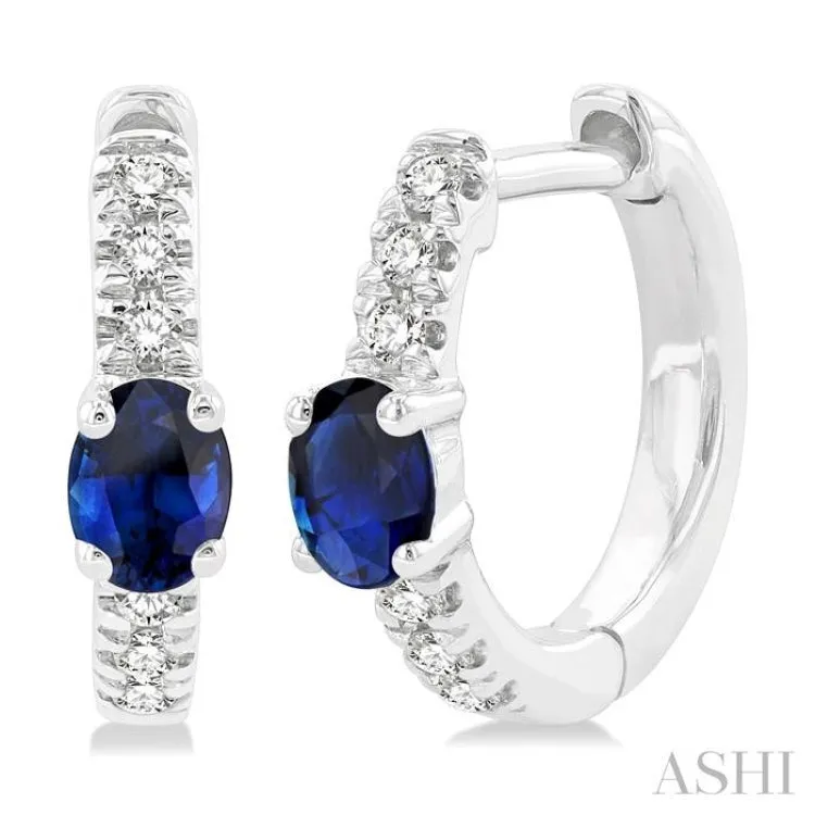 1/10 ctw Petite 4X3MM Oval Cut Sapphire and Round Cut Diamond Fashion Huggies in 10K White Gold