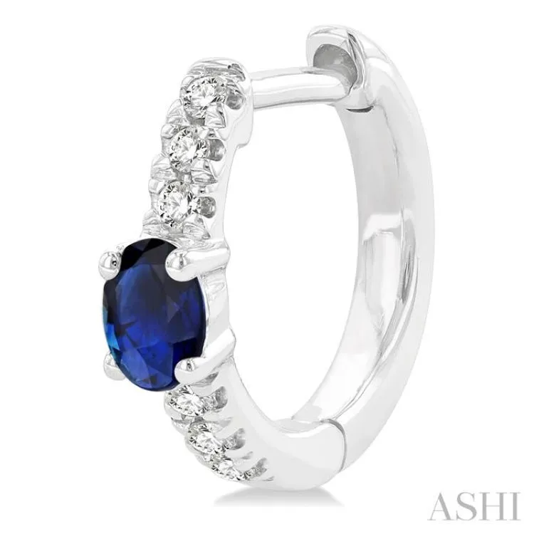 1/10 ctw Petite 4X3MM Oval Cut Sapphire and Round Cut Diamond Fashion Huggies in 10K White Gold