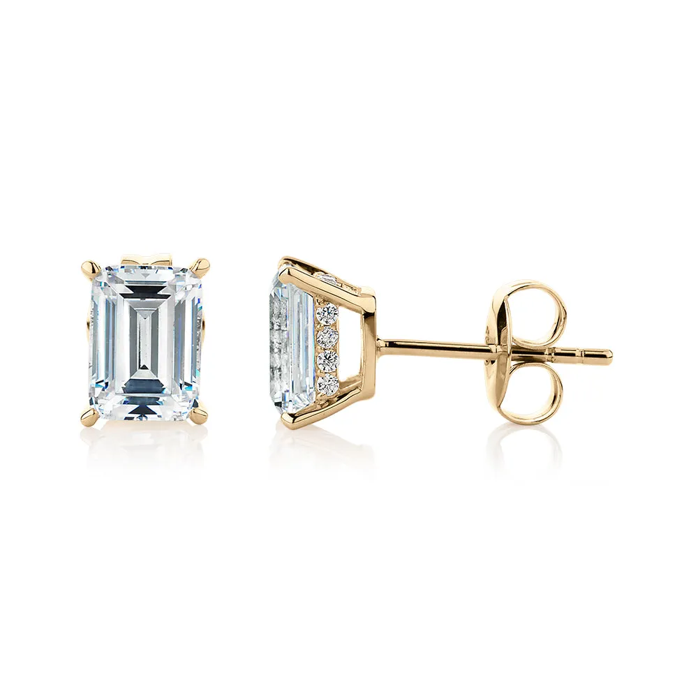 Emerald cut stud earrings with 2.24 carats* of diamond simulants in 10 carat yellow gold