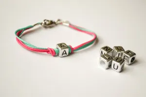 Initial bracelet for children, pink and turquoise cord
